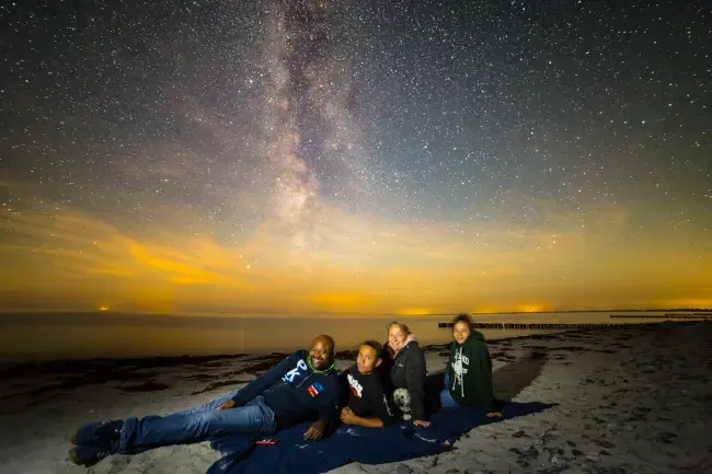Family at the beach at Dark Sky Møn